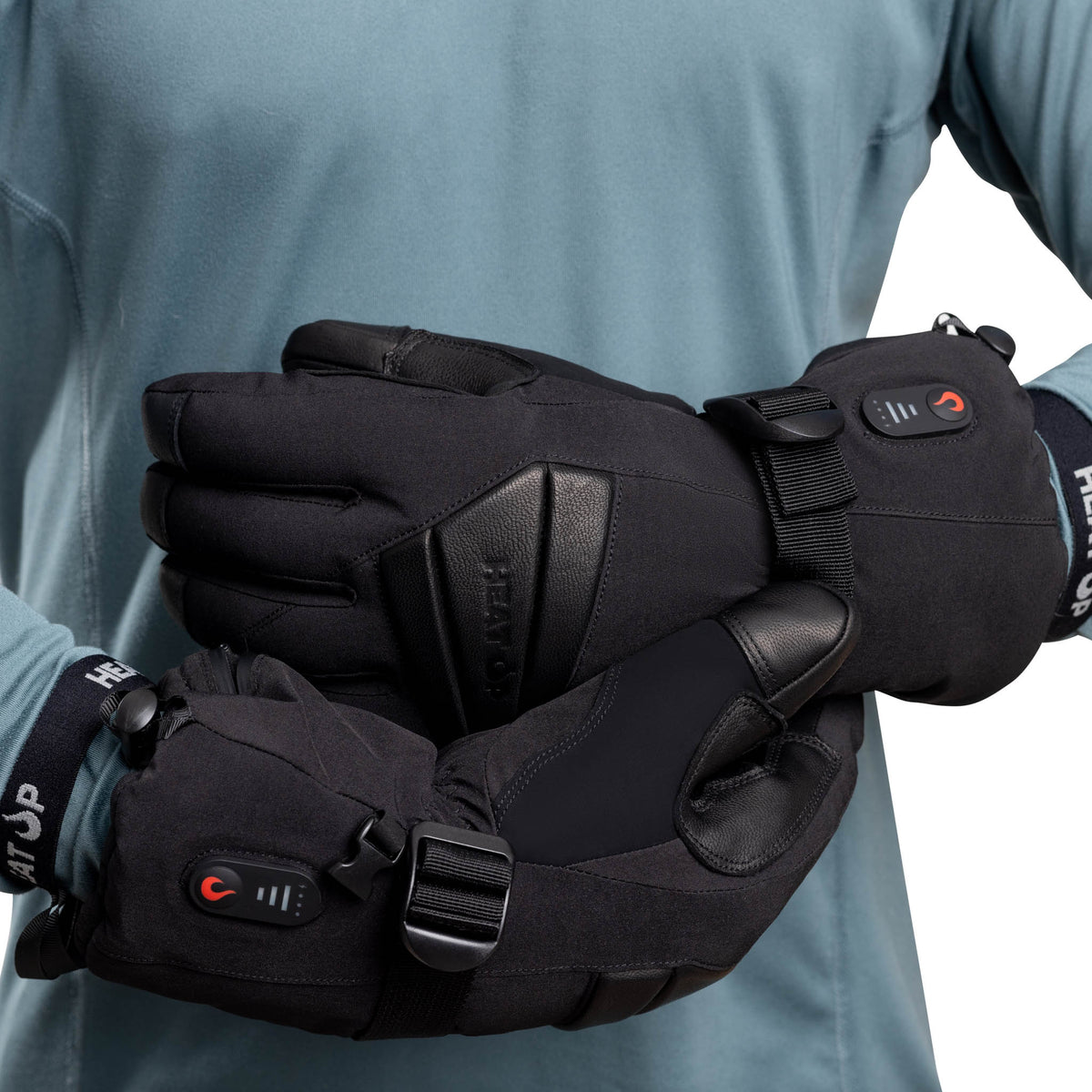 Heat Up Peak heated gloves worn on both hands, leather palm and cuff buckle visible